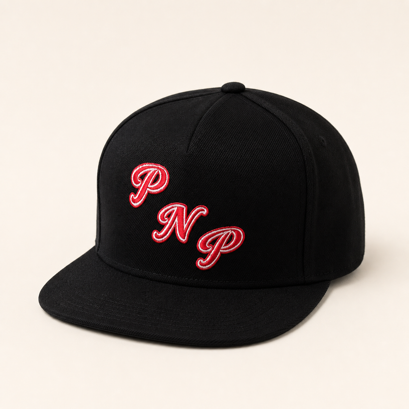 PNP Snapback in black — front three-quarter view with red and white PNP embroidery